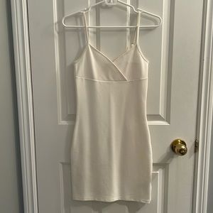 Selling a mini, slightly bodycon, white dress. No stains and adjustable straps.